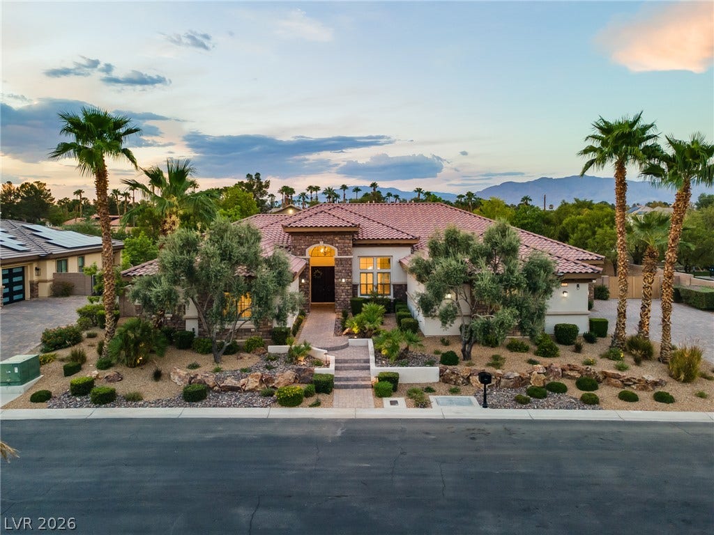 8030 Palm Cove Court, Las Vegas, NV 89129 Exquisite desert landscaping and a tiled roof define this elegant, single-level estate.