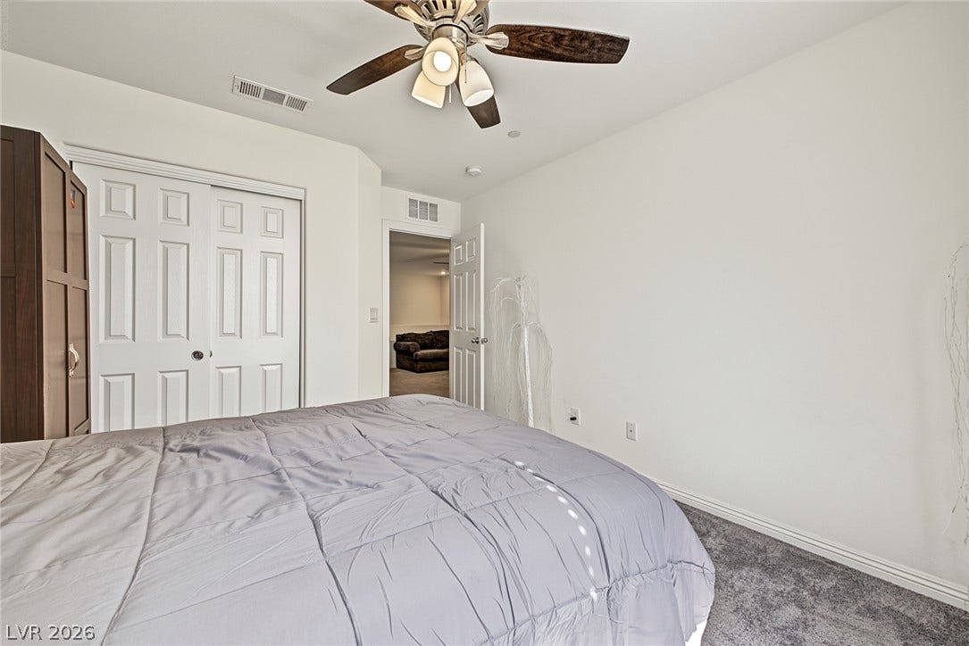 1180 Gypsum Hills Court, Henderson, NV 89002 Plush carpeting and clean white walls create a quiet retreat in this cozy bedroom.