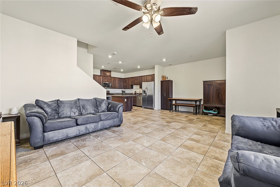 1180 Gypsum Hills Court, Henderson, NV 89002 An open floorplan seamlessly connects the tiled living space to the adjacent kitchen.