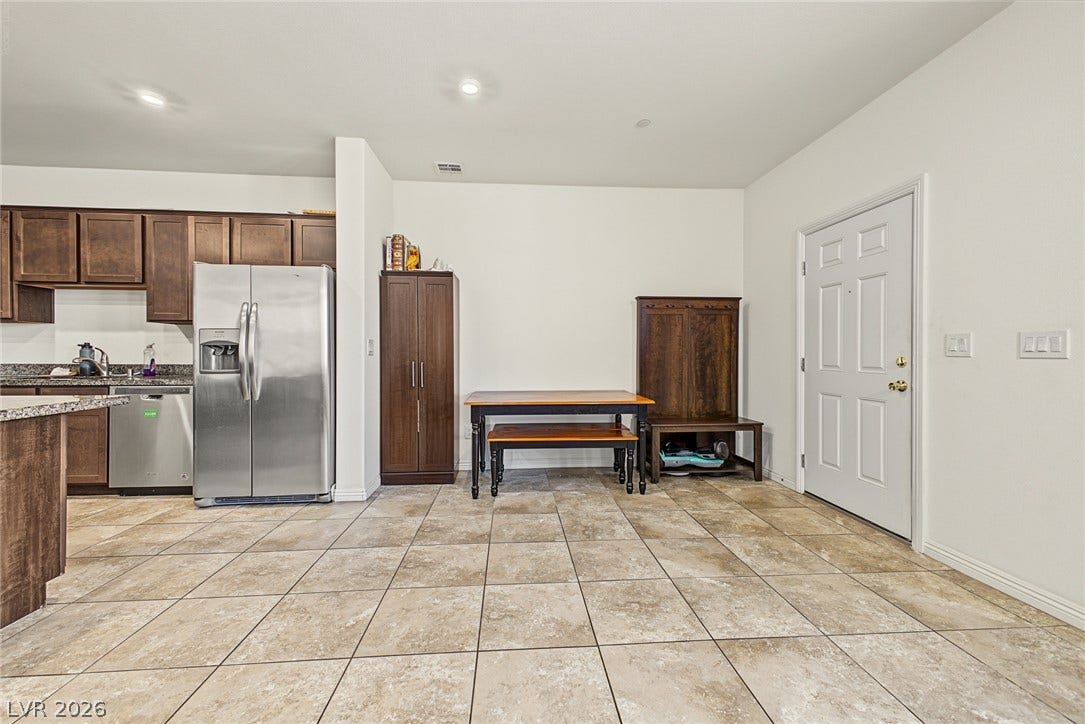 1180 Gypsum Hills Court, Henderson, NV 89002 Durable tile flooring runs throughout this open entryway and kitchen area.
