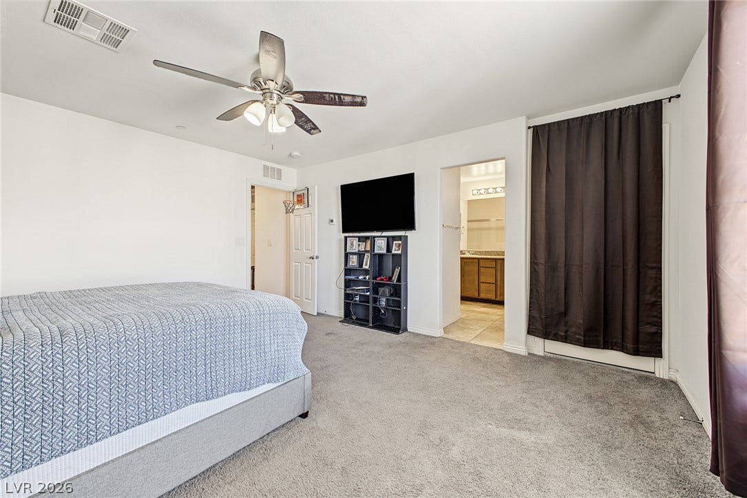 1180 Gypsum Hills Court, Henderson, NV 89002 An open doorway connects this plush carpeted space directly to the en suite bathroom.