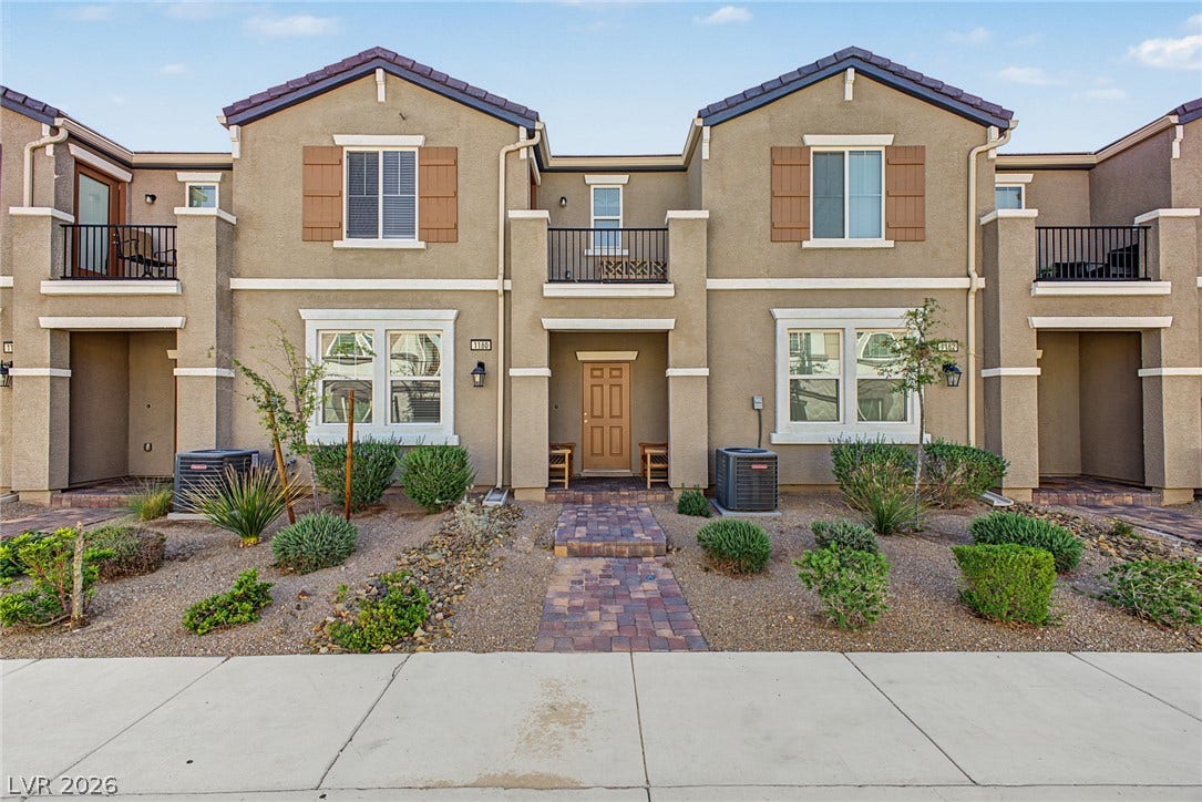 1180 Gypsum Hills Court, Henderson, NV 89002 Warm stucco exterior walls and classic shutters define this inviting multi-level townhouse design.