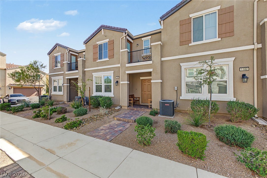 1180 Gypsum Hills Court, Henderson, NV 89002 Neat desert landscaping and a paved walkway line the approach to this multi-level stucco home.