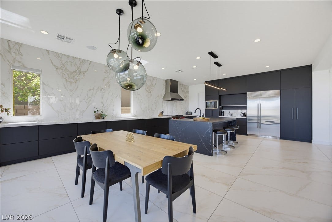 446 Bosco Di Fiore Street, Las Vegas, NV 89138 Clean lines and stone surfaces define this modern, open-concept culinary space.