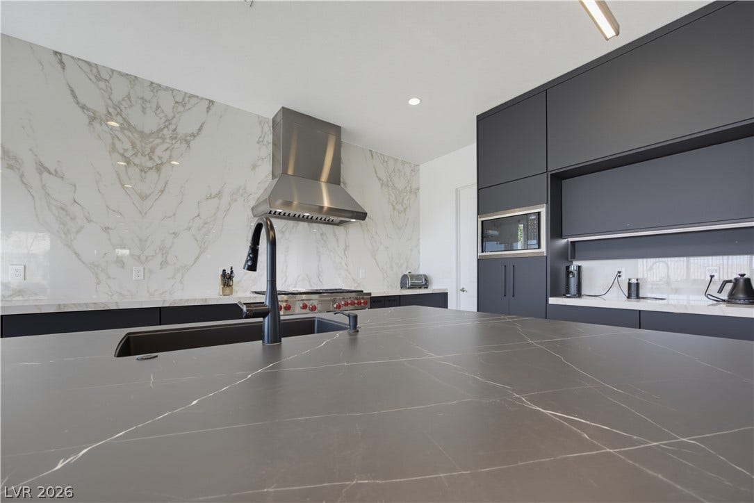446 Bosco Di Fiore Street, Las Vegas, NV 89138 Bold modern design unites with high-end stone finishes in this culinary space.