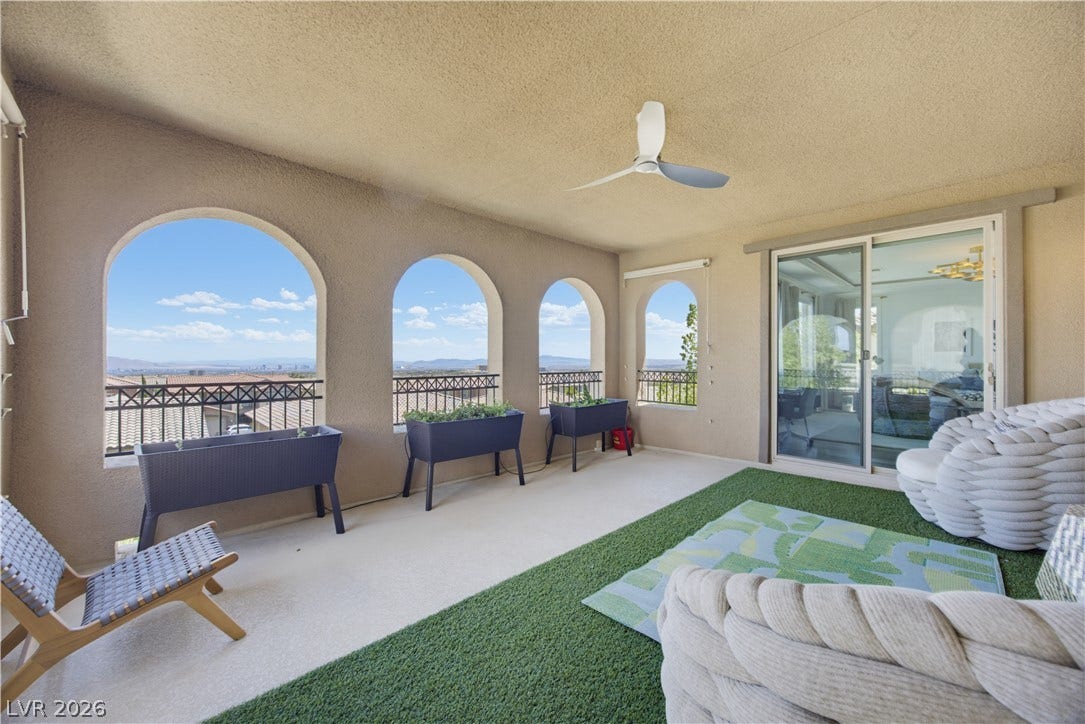 446 Bosco Di Fiore Street, Las Vegas, NV 89138 Arched openings frame far-reaching neighborhood vistas from this sheltered terrace.