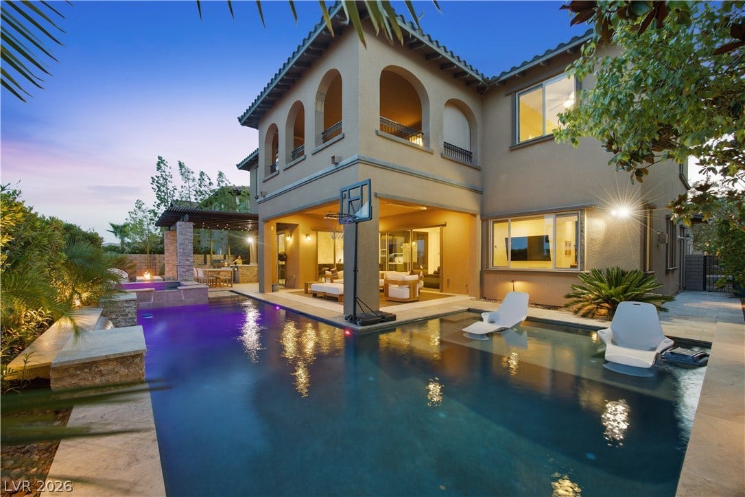 446 Bosco Di Fiore Street, Las Vegas, NV 89138 An inviting swimming pool and spa complement the elegant Mediterranean-style architecture of this backyard retreat.