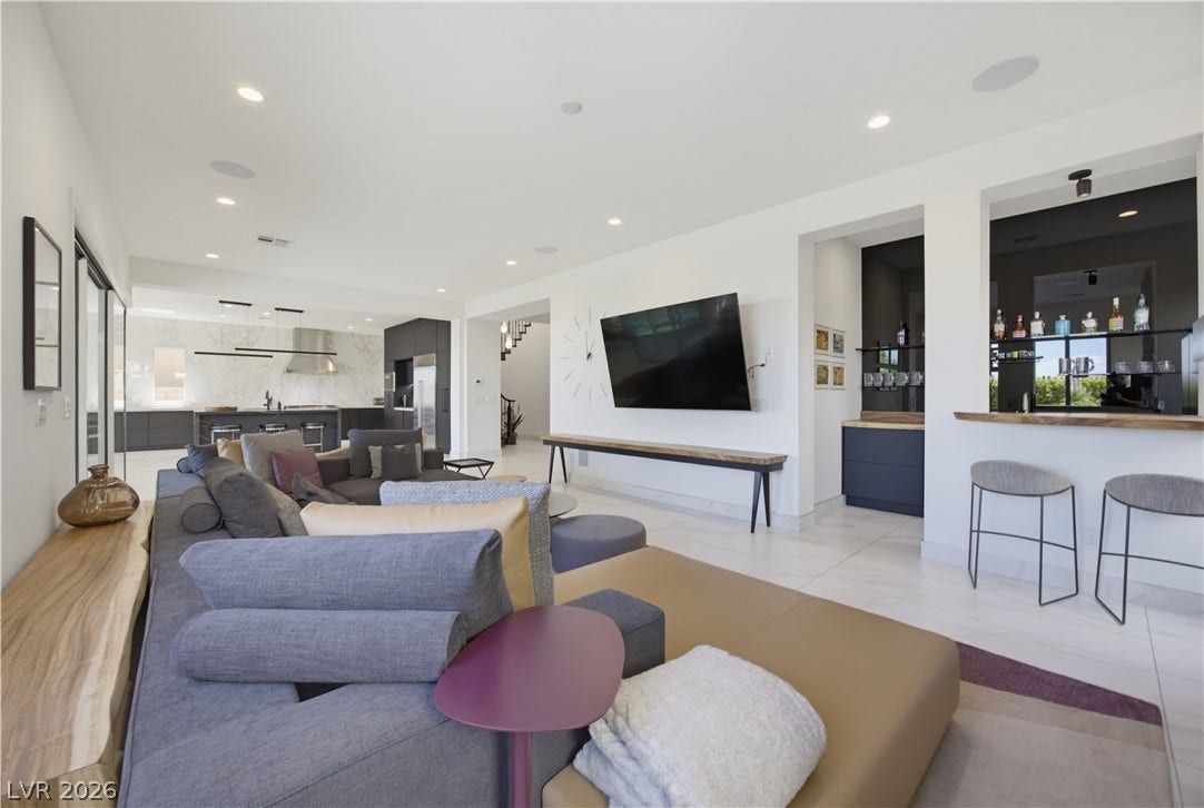 446 Bosco Di Fiore Street, Las Vegas, NV 89138 Gleaming tile floors and smooth plaster walls flow seamlessly throughout this open main-level living space.