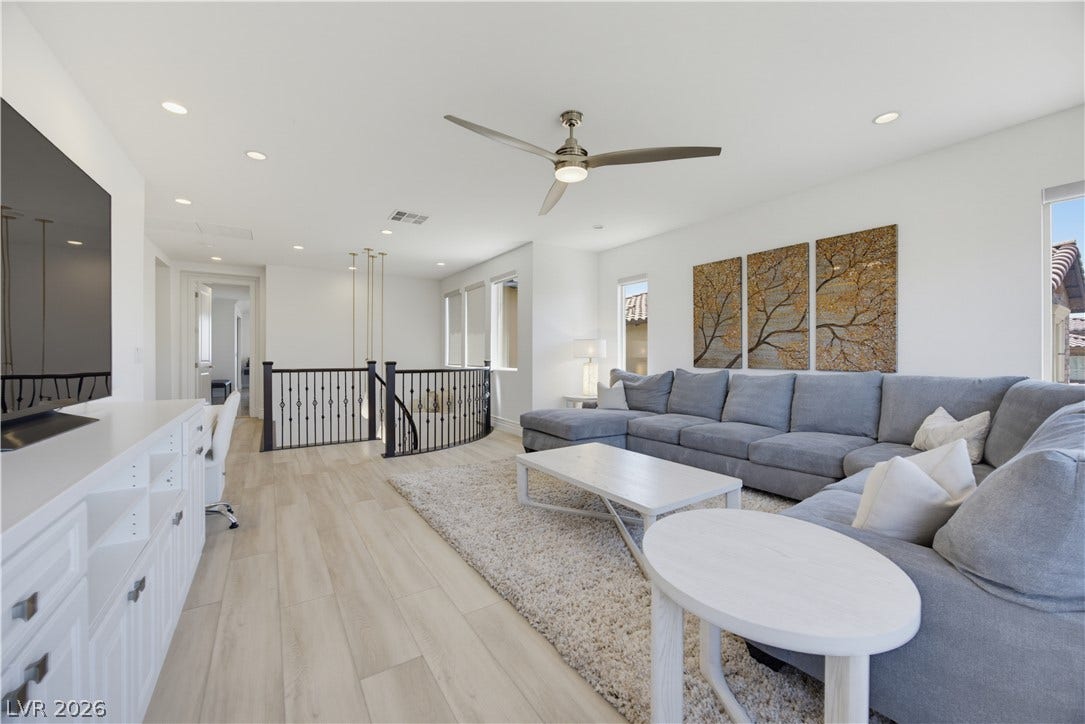 446 Bosco Di Fiore Street, Las Vegas, NV 89138 Sunlight pours across the light wood-style flooring in this airy upper-level retreat.