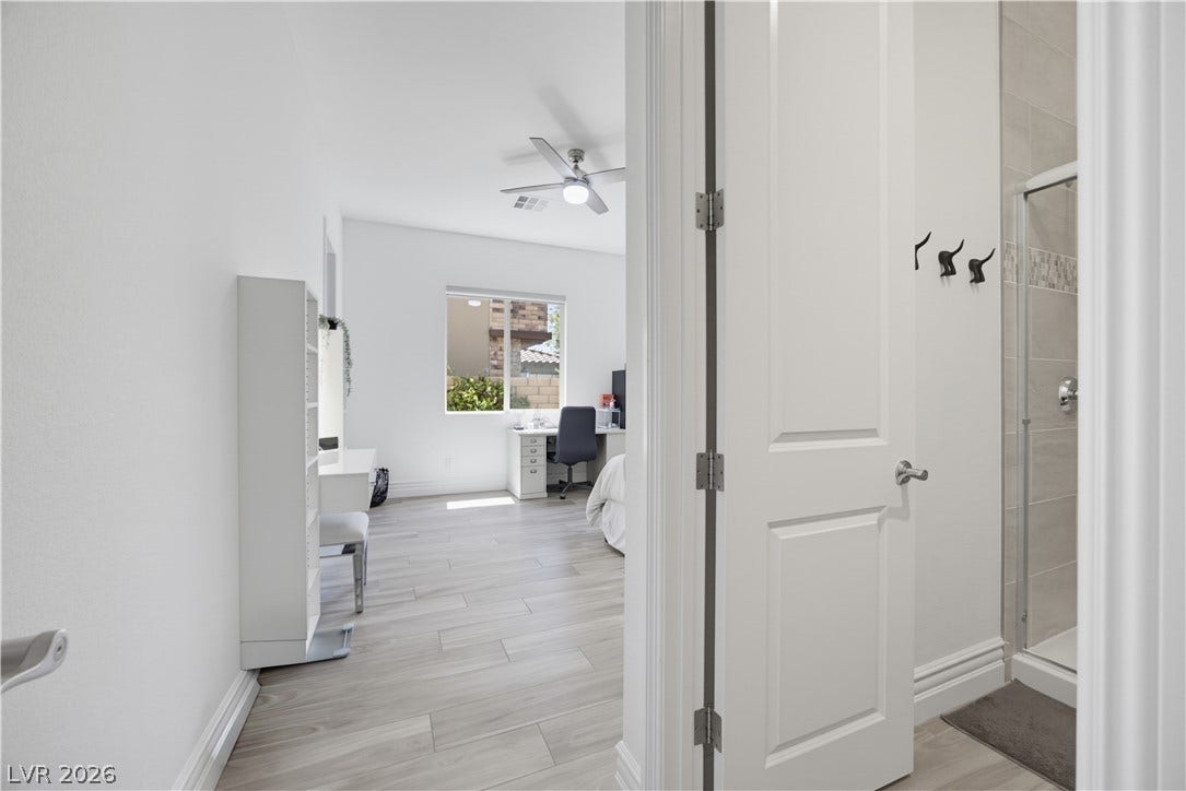 446 Bosco Di Fiore Street, Las Vegas, NV 89138 Gleaming tile floors guide the way into a versatile secondary bedroom suite.