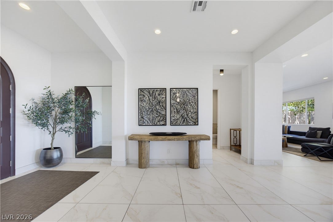 446 Bosco Di Fiore Street, Las Vegas, NV 89138 Polished tile flooring and clean architectural lines create an immediate sense of arrival.
