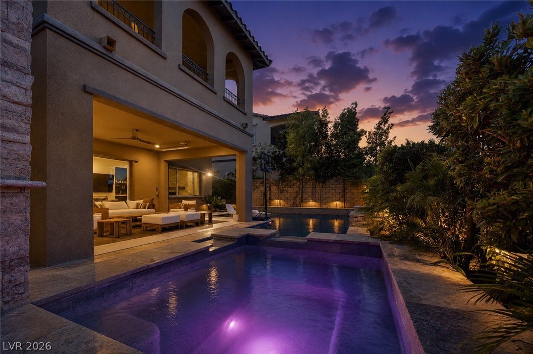 446 Bosco Di Fiore Street, Las Vegas, NV 89138 A sparkling pool and spa sit adjacent to a covered outdoor living pavilion.