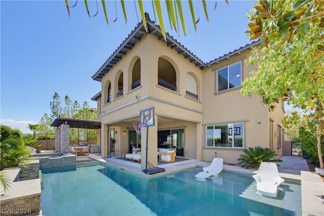 446 Bosco Di Fiore Street, Las Vegas, NV 89138 An inviting backyard oasis centers around a sparkling custom swimming pool and covered loggia.
