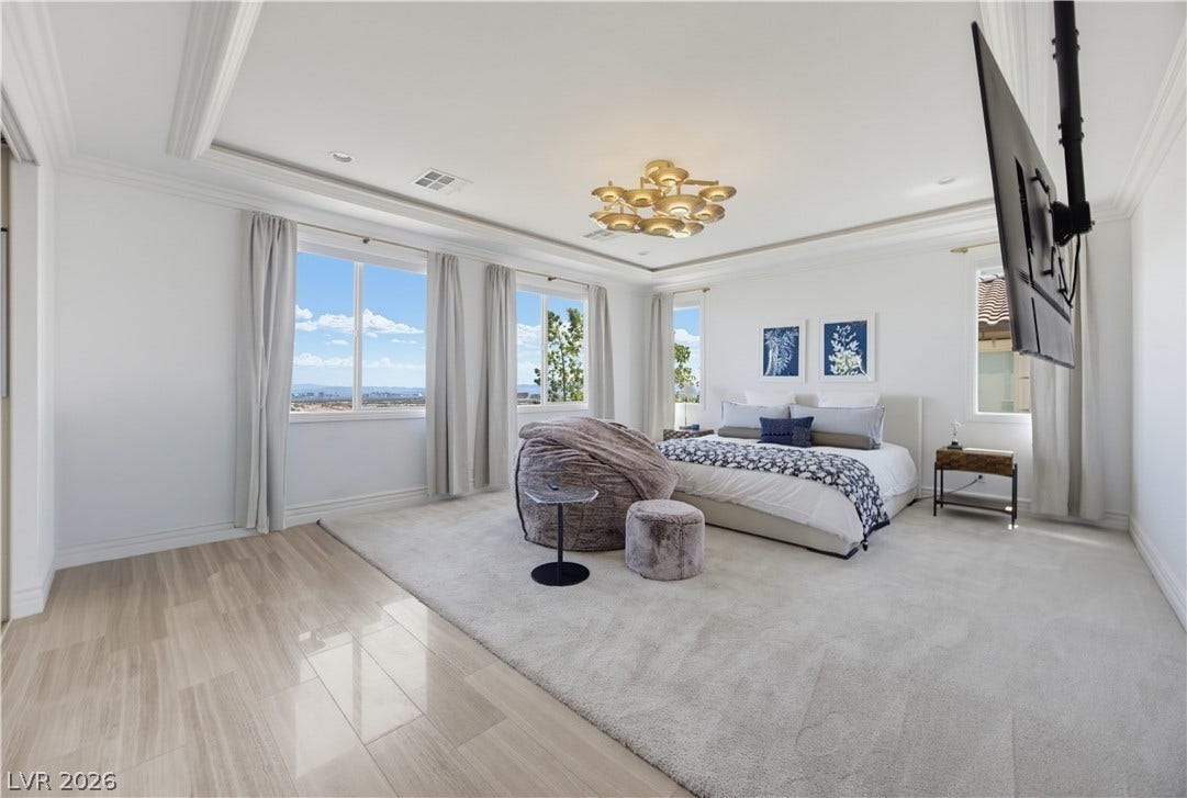 446 Bosco Di Fiore Street, Las Vegas, NV 89138 Gleaming wood floors and a tray ceiling define this light-filled principal suite with expansive views.