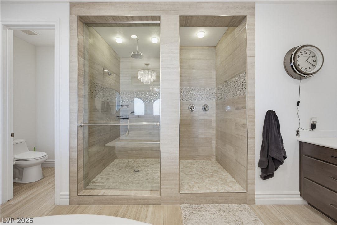446 Bosco Di Fiore Street, Las Vegas, NV 89138 Custom tiled walk-in showers define this modern spa-like bathroom.