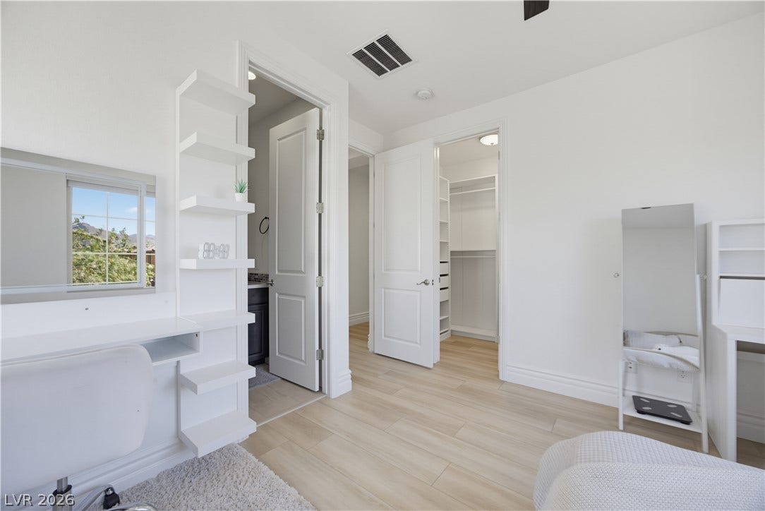 446 Bosco Di Fiore Street, Las Vegas, NV 89138 Smooth wood floors and crisp white walls define this airy, well-lit private retreat.