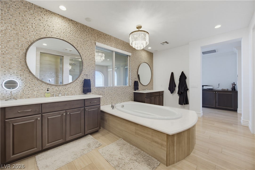 446 Bosco Di Fiore Street, Las Vegas, NV 89138 Elegant tile accents and a soaking tub define this spacious master bath layout.