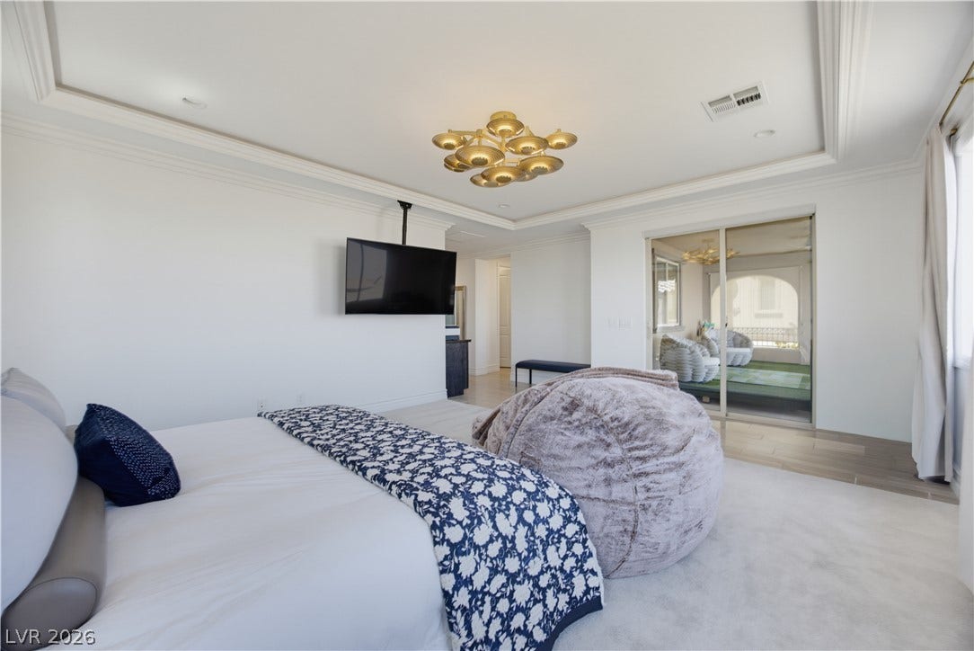 446 Bosco Di Fiore Street, Las Vegas, NV 89138 Plush carpeting and elegant tray ceilings define this spacious bedroom suite.