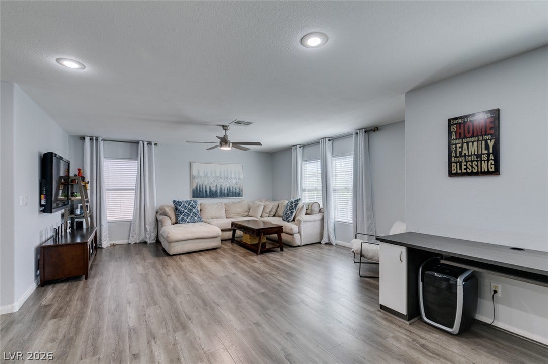 236 Fox Lake Avenue, Las Vegas, NV 89148 Plank flooring and recessed lighting define this spacious open living area.