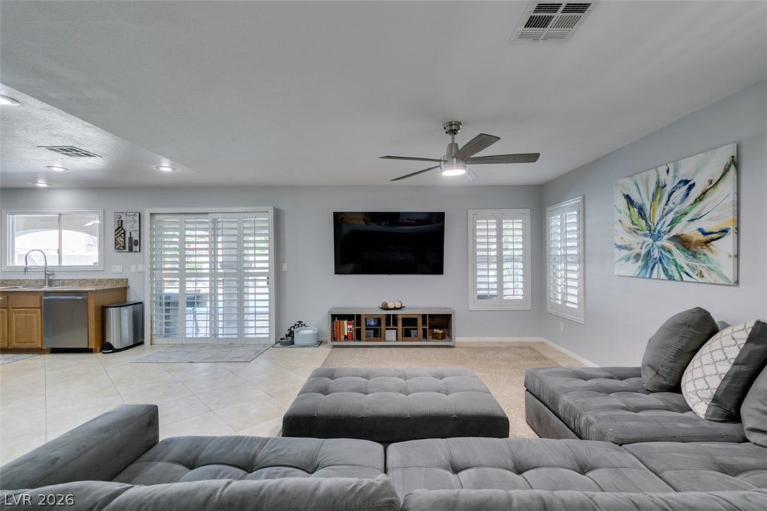 236 Fox Lake Avenue, Las Vegas, NV 89148 An open floorplan seamlessly connects the living space to the adjacent kitchen area.