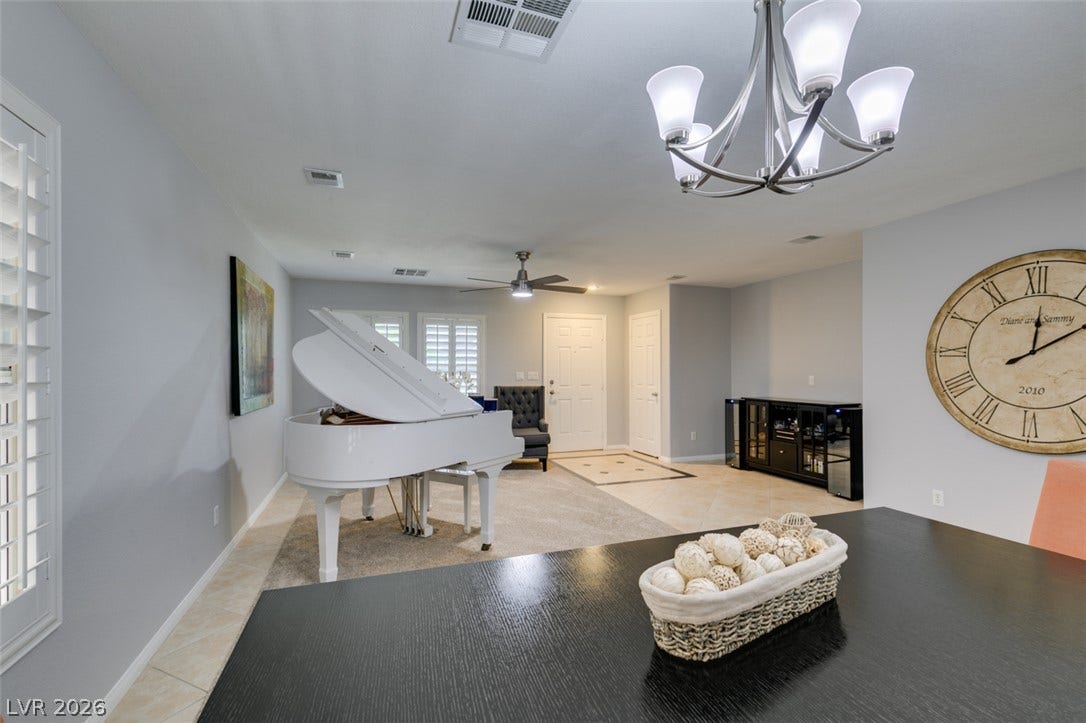 236 Fox Lake Avenue, Las Vegas, NV 89148 An open floorplan flows seamlessly from the formal dining space to the bright entry foyer.