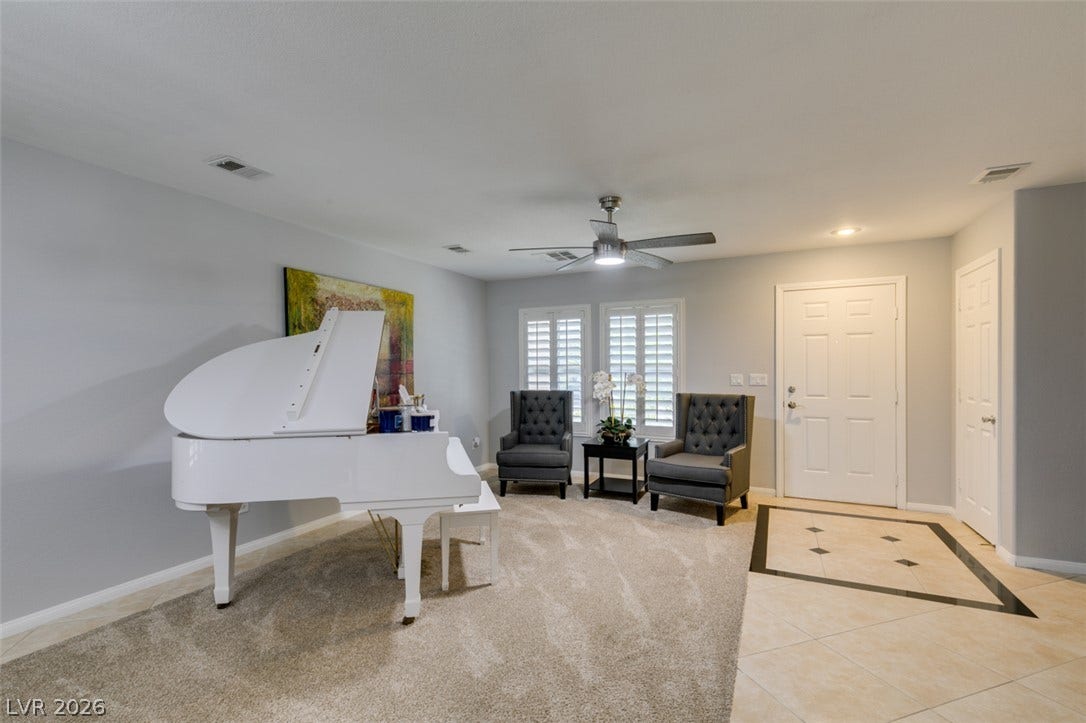 236 Fox Lake Avenue, Las Vegas, NV 89148 Plush carpeting meets tiled flooring in this welcoming entryway and living space.