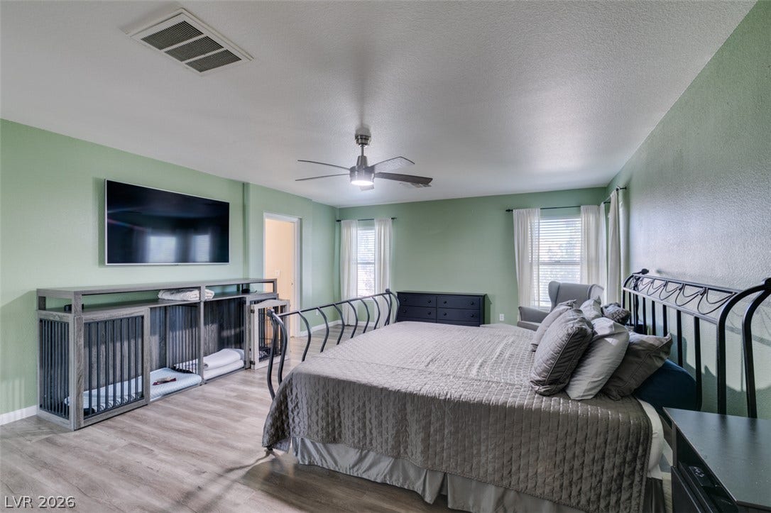 236 Fox Lake Avenue, Las Vegas, NV 89148 Smooth wood-look flooring and multiple windows enhance this comfortable personal retreat.