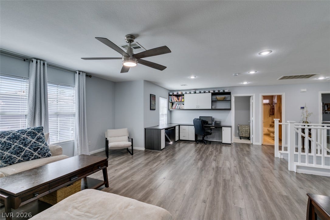 236 Fox Lake Avenue, Las Vegas, NV 89148 Polished wood-look flooring and recessed lighting define this versatile upstairs bonus living area.