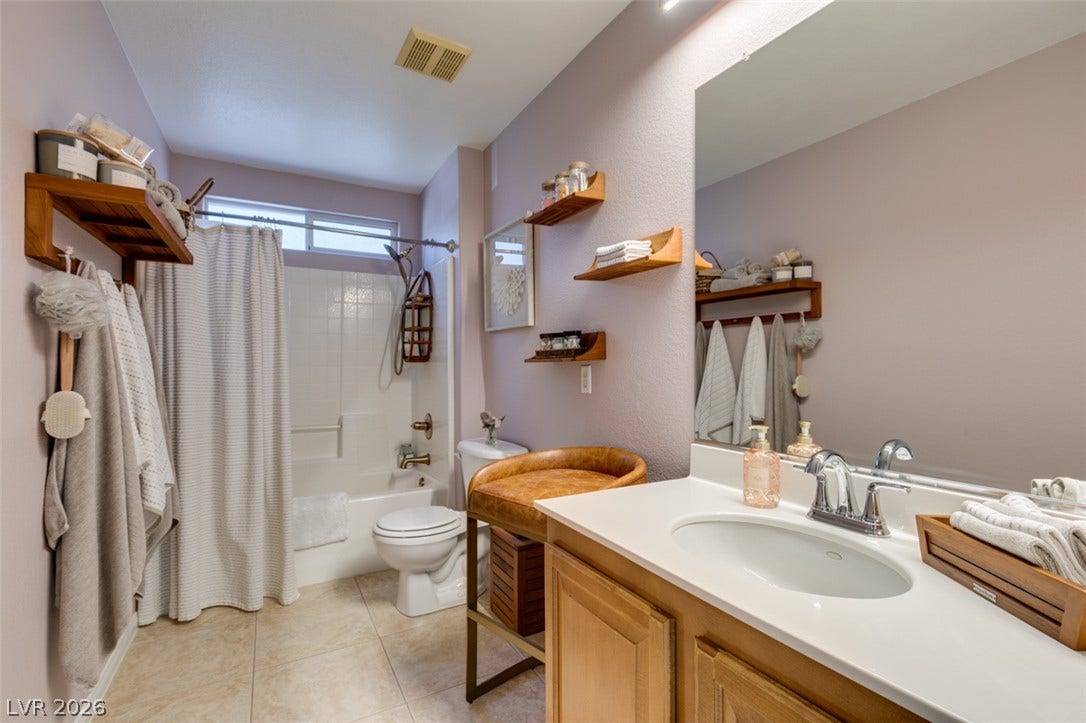 236 Fox Lake Avenue, Las Vegas, NV 89148 A spacious vanity and tile flooring define this functional bathroom layout.