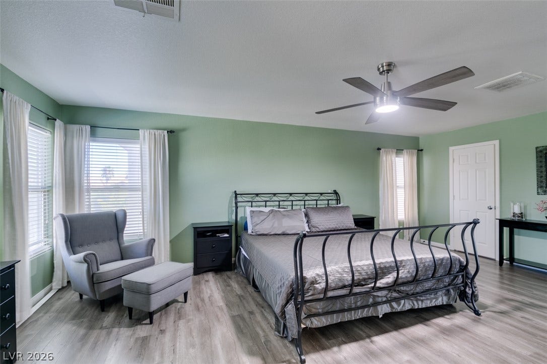 236 Fox Lake Avenue, Las Vegas, NV 89148 Smooth wood-look flooring and multiple windows enhance this relaxing private retreat.