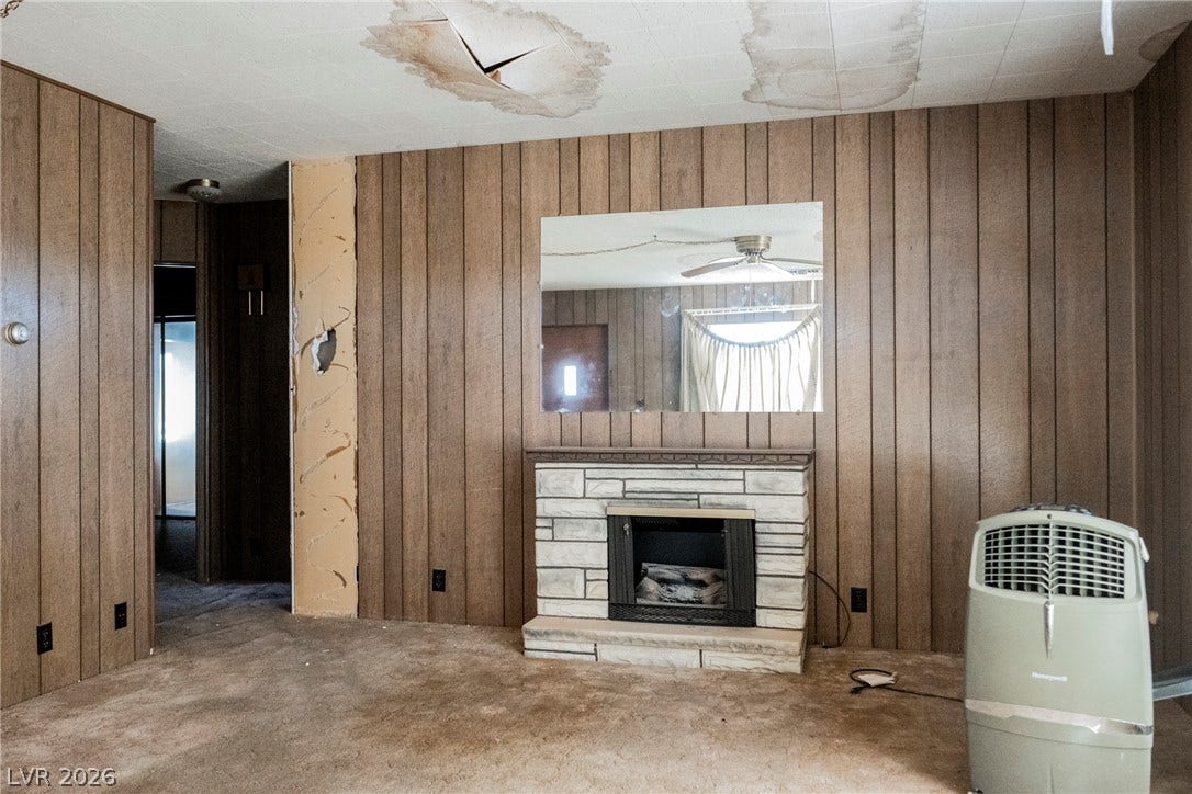 1012 Cadiz Avenue, Henderson, NV 89015 Wood paneling and a stone-faced fireplace anchor the central living space.