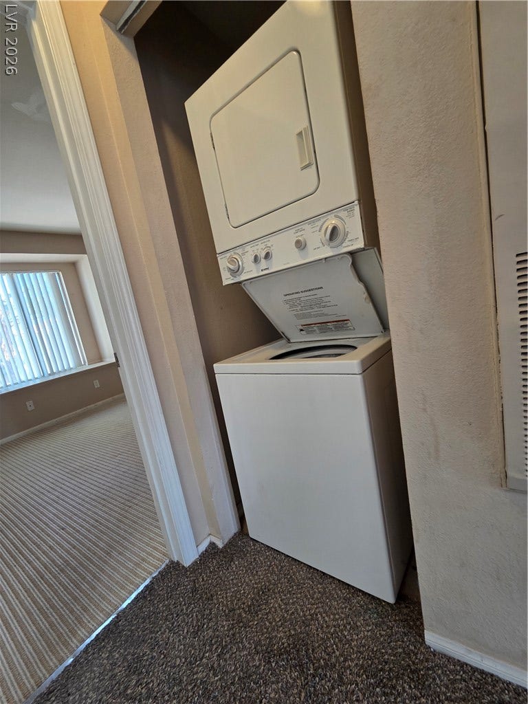 7300 Pirates Cove Road, #2060, Las Vegas, NV 89145 A dedicated laundry closet features a stacked washer and dryer unit for convenient home maintenance.