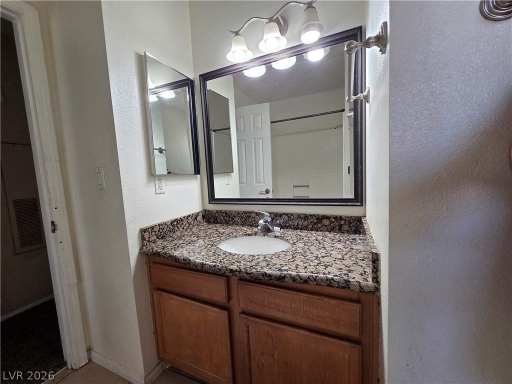 7300 Pirates Cove Road, #2060, Las Vegas, NV 89145 Polished granite countertops bring a refined feel to the vanity area.