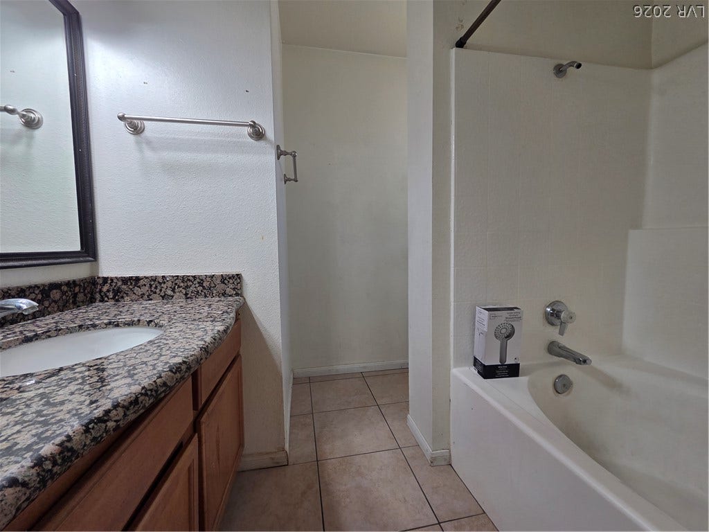7300 Pirates Cove Road, #2060, Las Vegas, NV 89145 Granite counters and tiled flooring enhance the functional layout of this bathroom.
