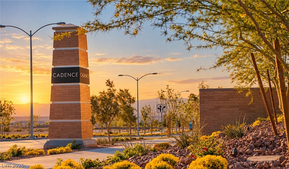 A prominent masonry monument sign welcomes residents to the master-planned neighborhood at sunset.