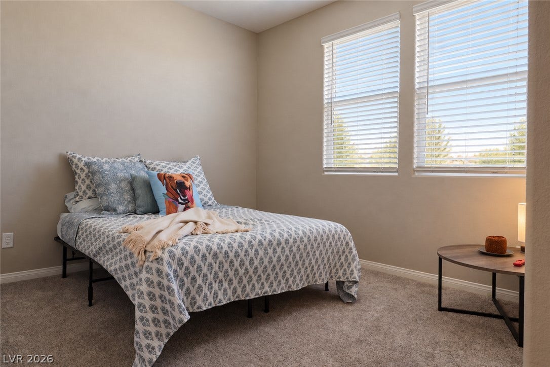 Soft wall-to-wall carpeting and twin windows define this comfortable and private retreat.