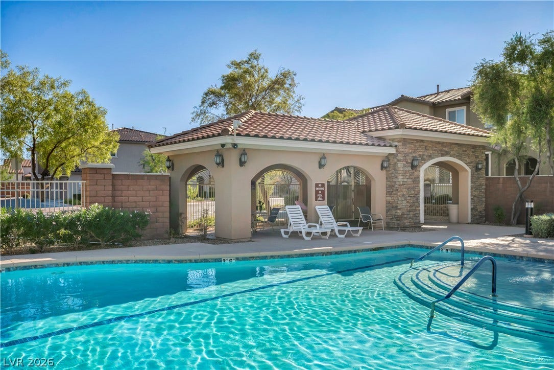 8577 Insignia Avenue, #101, Las Vegas, NV 89178 Shimmering water highlights a spacious community pool complex complete with a sheltered cabana area.