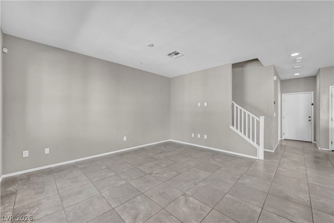 8577 Insignia Avenue, #101, Las Vegas, NV 89178 Durable tile flooring and a neutral color palette define this versatile open living space.
