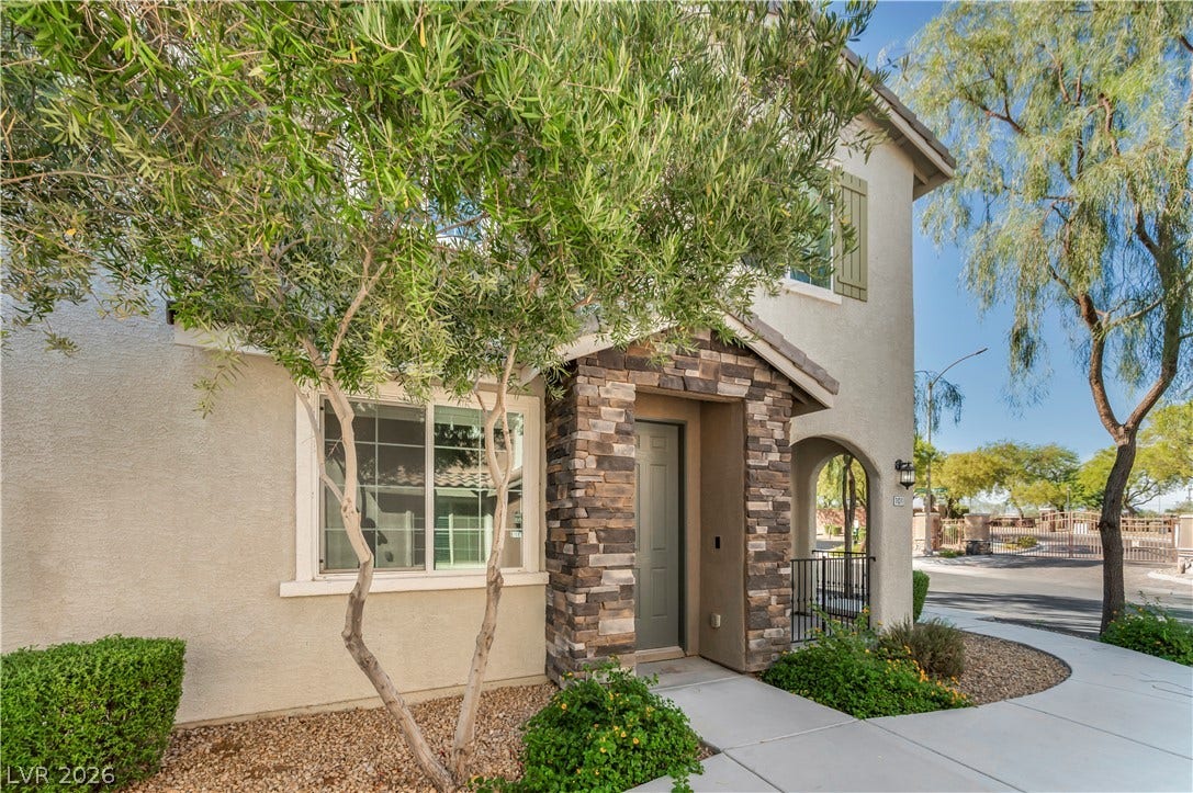 8577 Insignia Avenue, #101, Las Vegas, NV 89178 Stone accents and a covered entryway establish strong architectural appeal.