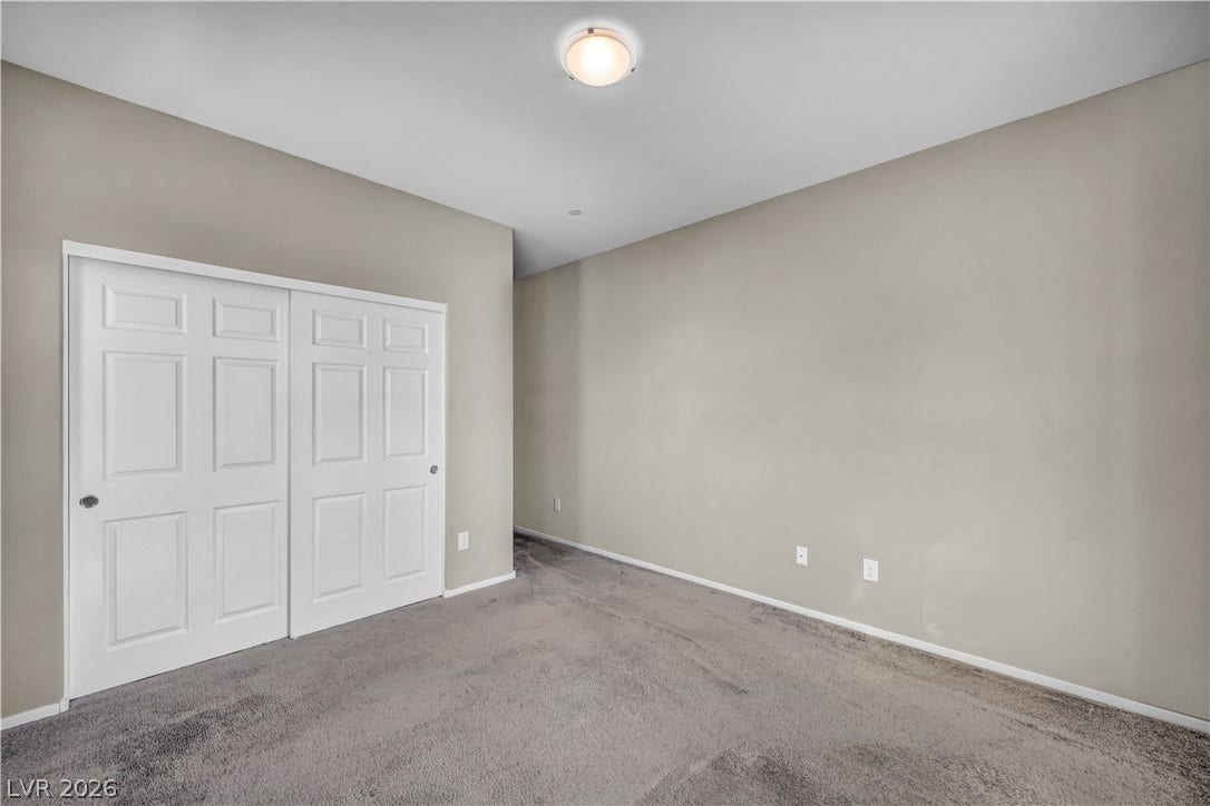 8577 Insignia Avenue, #101, Las Vegas, NV 89178 Smooth neutral walls and soft wall-to-wall carpeting define this versatile interior space.