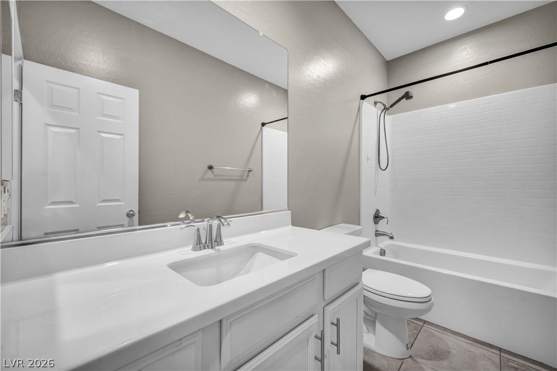 8577 Insignia Avenue, #101, Las Vegas, NV 89178 Clean lines and classic subway tile define this functional bathroom layout.