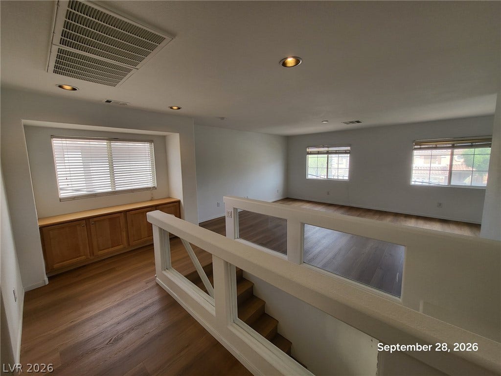 7619 Good Fortune Court, Las Vegas, NV 89139 Clean lines and warm wood floors define this open upper-level landing and multi-purpose living space.