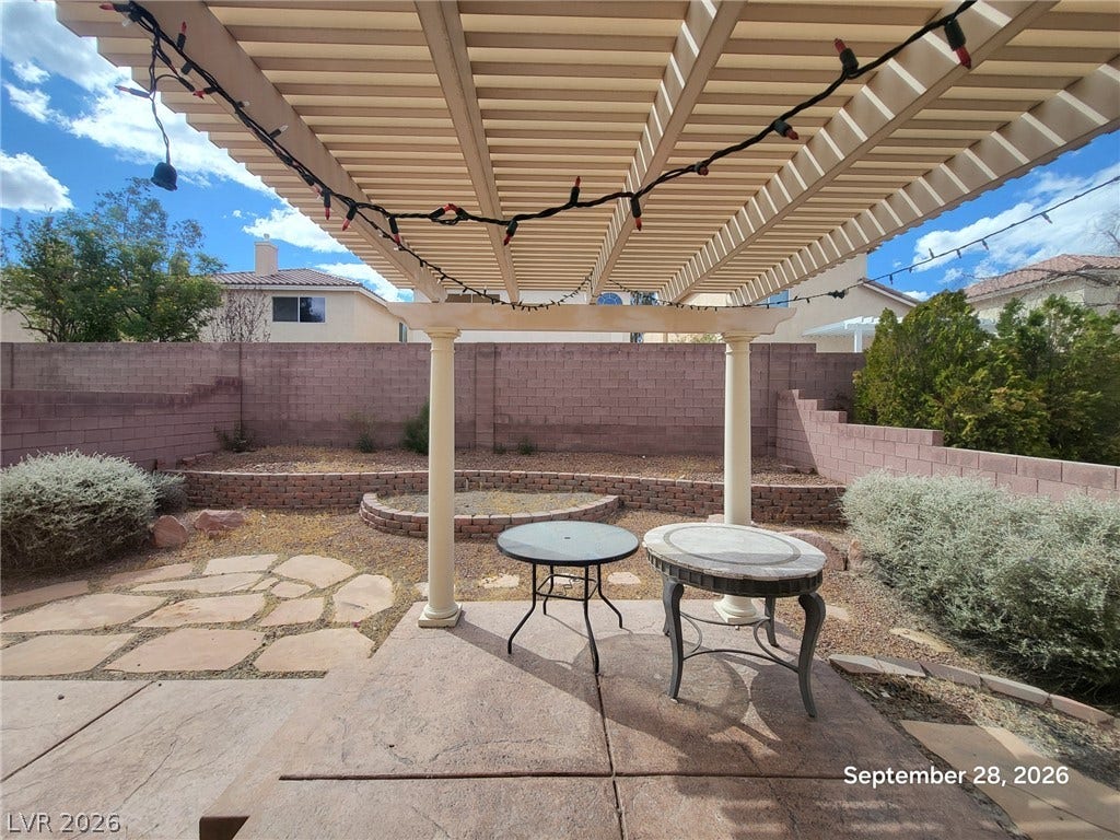 7619 Good Fortune Court, Las Vegas, NV 89139 An inviting backyard patio sheltered by a classic pergola structure provides the perfect outdoor retreat.
