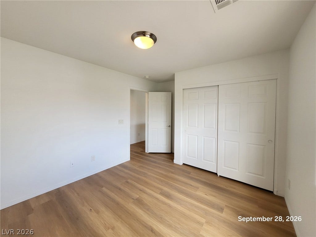 7619 Good Fortune Court, Las Vegas, NV 89139 Warm wood flooring and clean white walls create a versatile canvas for any layout.