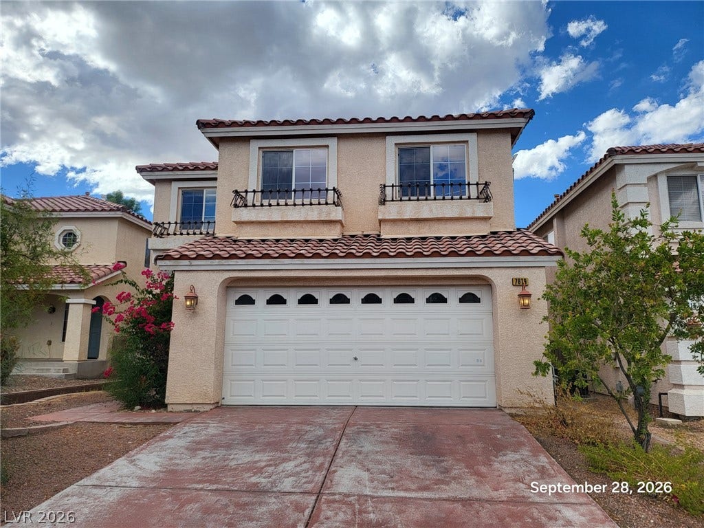 7619 Good Fortune Court, Las Vegas, NV 89139 Mediterranean architectural details and a tile roof define this two-story exterior facade.