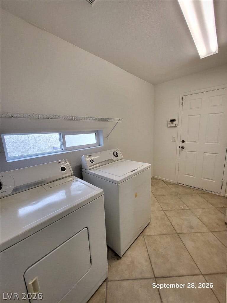 7619 Good Fortune Court, Las Vegas, NV 89139 Tiled flooring and a horizontal window enhance this functional utility space.