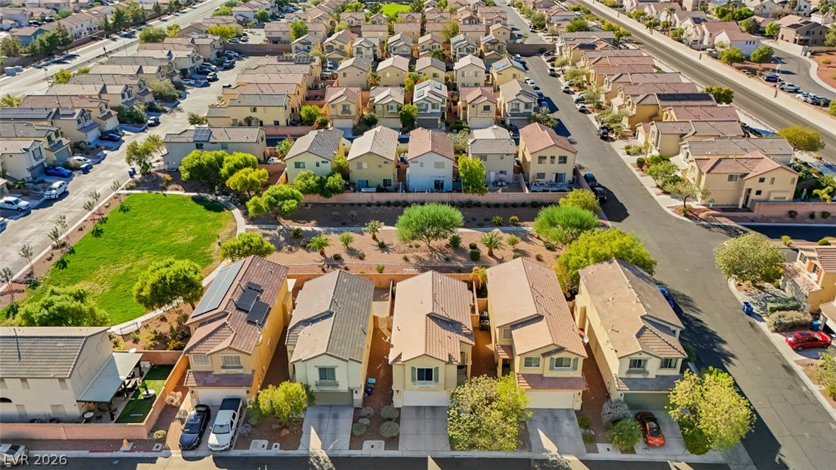 An aerial perspective showcases a neat residential neighborhood filled with stylish two-story homes.
