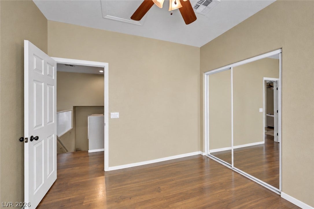 Second upstairs bedroom next to kitchen. (AI used to remove items from space).