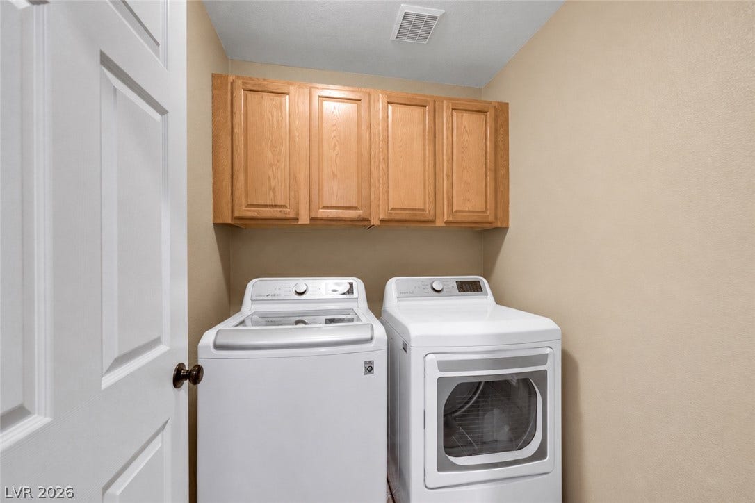 Laundry room with cabinets located on the first story next to the den, full bath, and first story bedroom. (AI used to remove items from space).