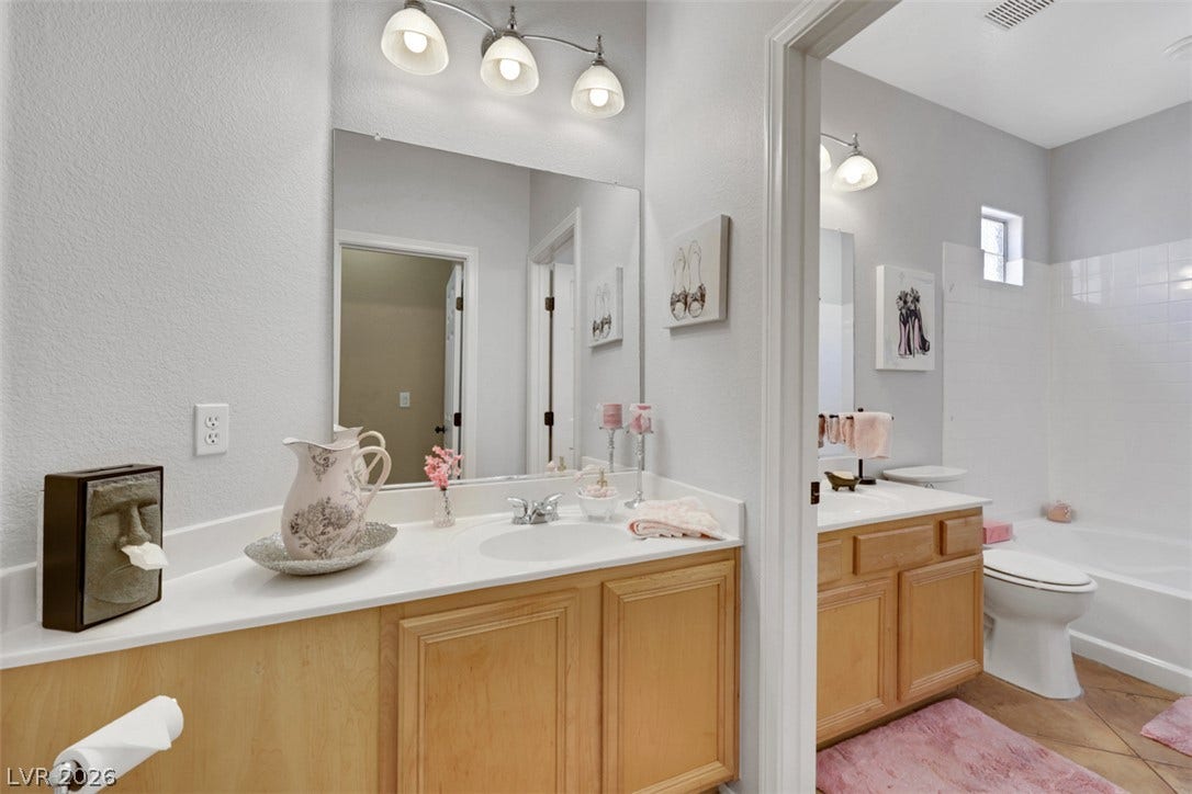 Guest bath located next to primary suite bath.